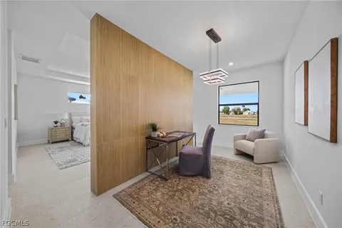 a spacious bedroom with a bed and a window