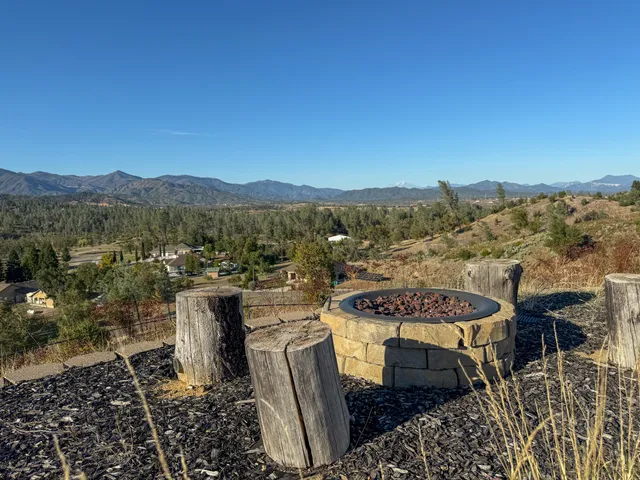 a view of a chairs and table in patio