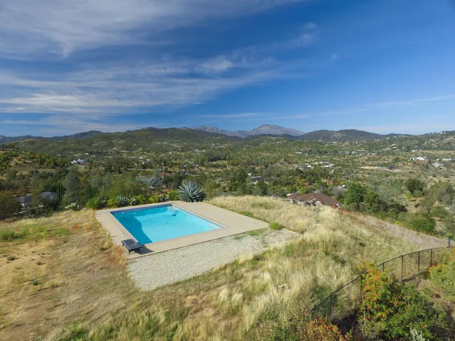 a view of an ocean with a mountain