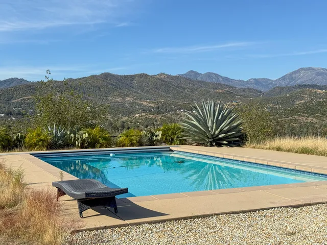 a view of swimming pool with a lounge chair