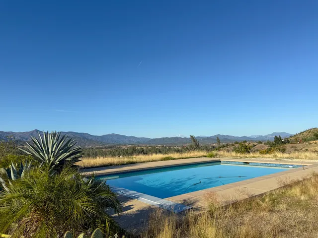 a view of a city with lawn chairs