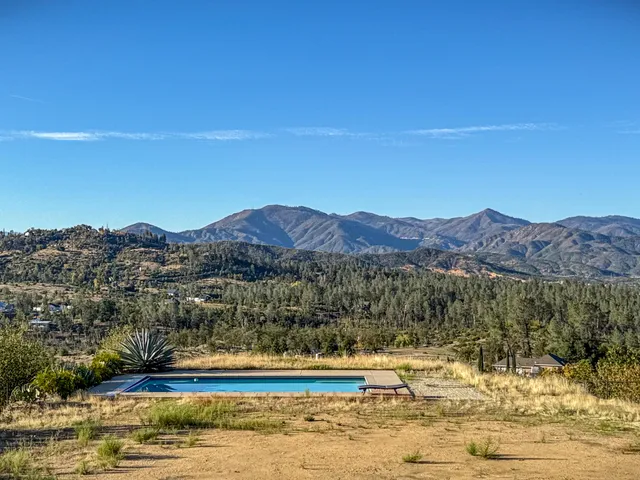a view of a lake with mountains in the background
