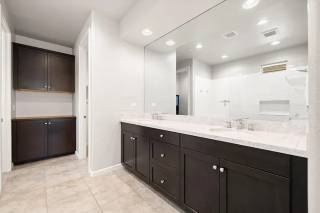 a backyard of a house with outdoor seating