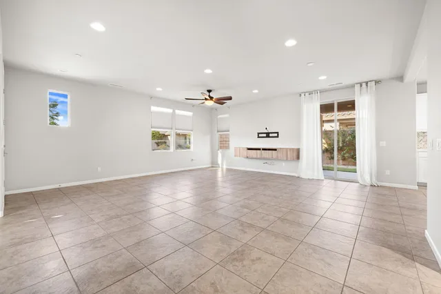 a view of an empty room and a window