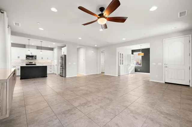 a view of an empty room and a window