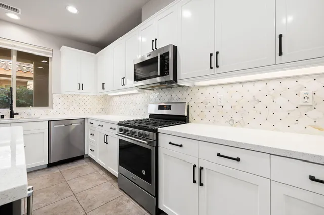 a view of a kitchen with furniture and a window