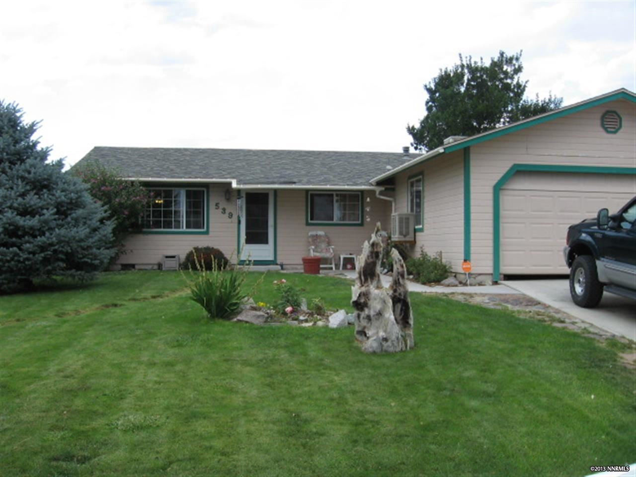 539 Yellow Jacket Road Dayton, NV 89403 - Photo 1 of 1 a front view of house with yard and green space
