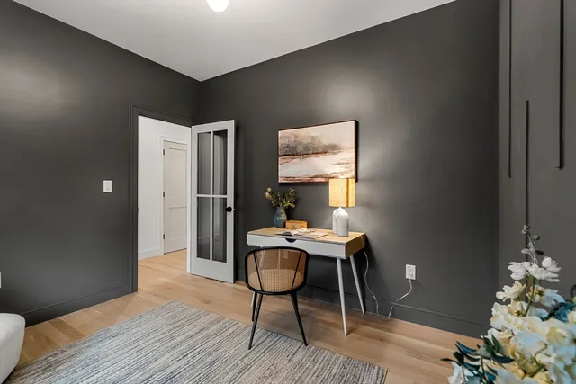 a workspace with furniture and wooden floor