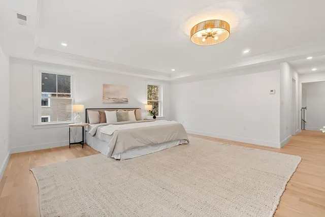 a bedroom with a bed and a lamp