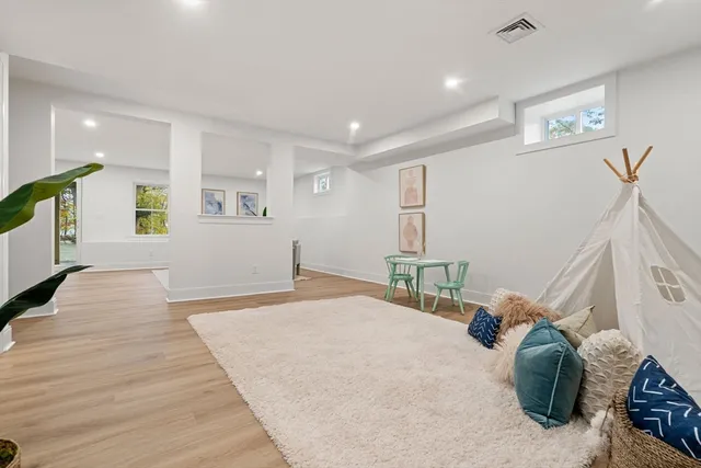 a living room with furniture and a table