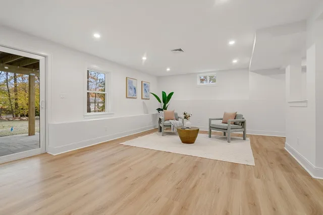 a room with a bed and a cabinets