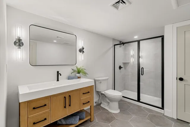 a view of a white house with a yard