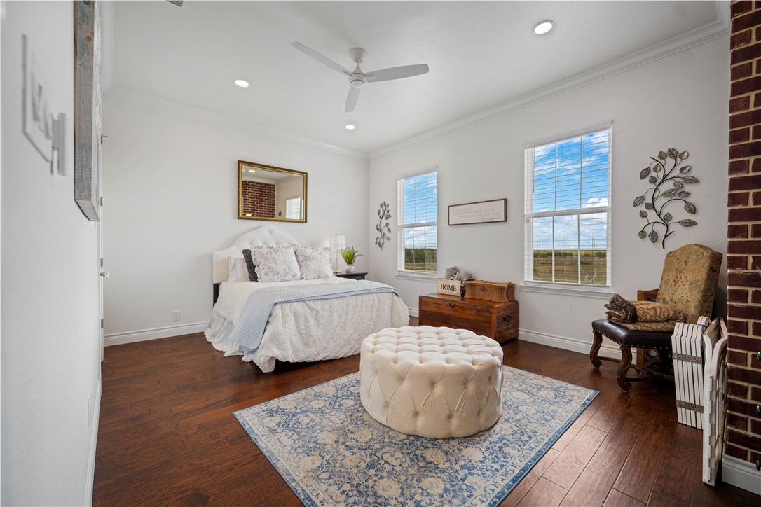 741 County Road 159 Kenedy, TX 78119 - Photo 12 of 37 a bedroom with a bed and a couch