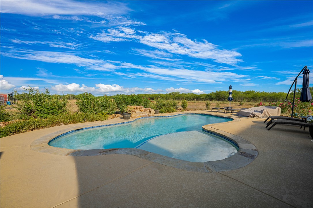 741 County Road 159 Kenedy, TX 78119 - Photo 14 of 37 a view of swimming pool with outdoor seating
