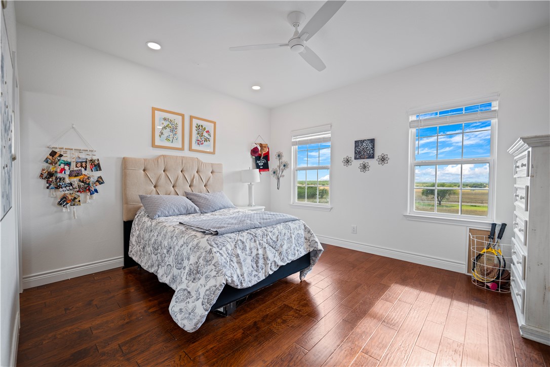 741 County Road 159 Kenedy, TX 78119 - Photo 18 of 37 a bedroom with a bed and wooden floor