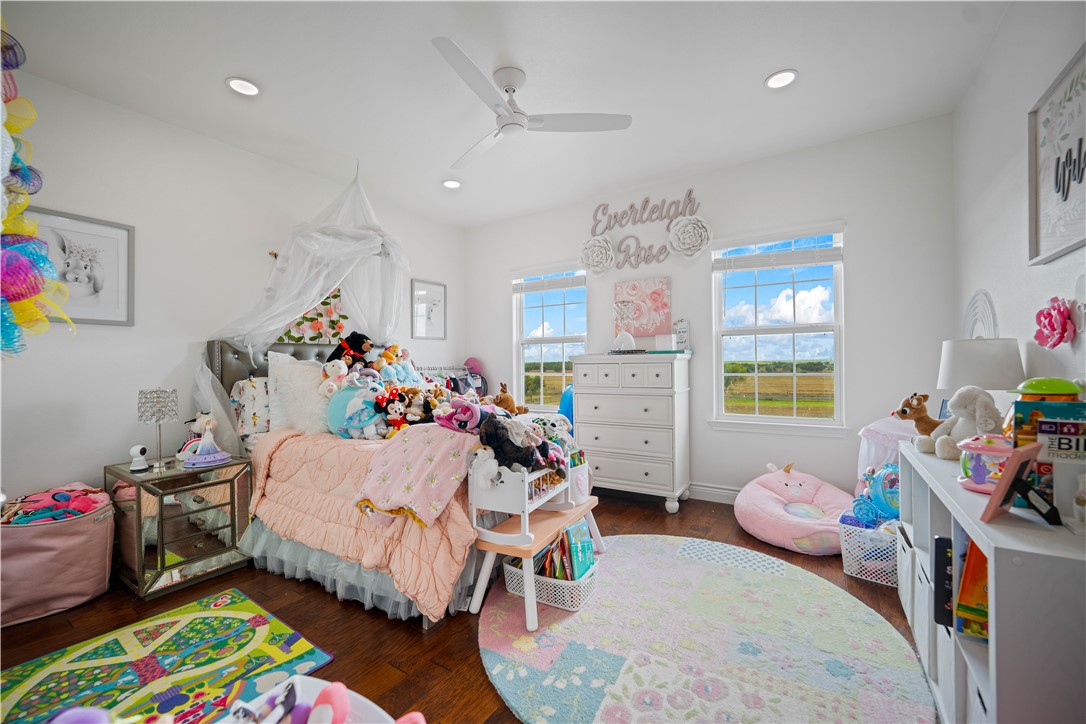 741 County Road 159 Kenedy, TX 78119 - Photo 20 of 37 a bed room with furniture and a wooden floor
