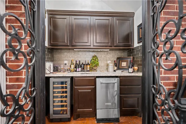 a kitchen with stainless steel appliances a sink and cabinets