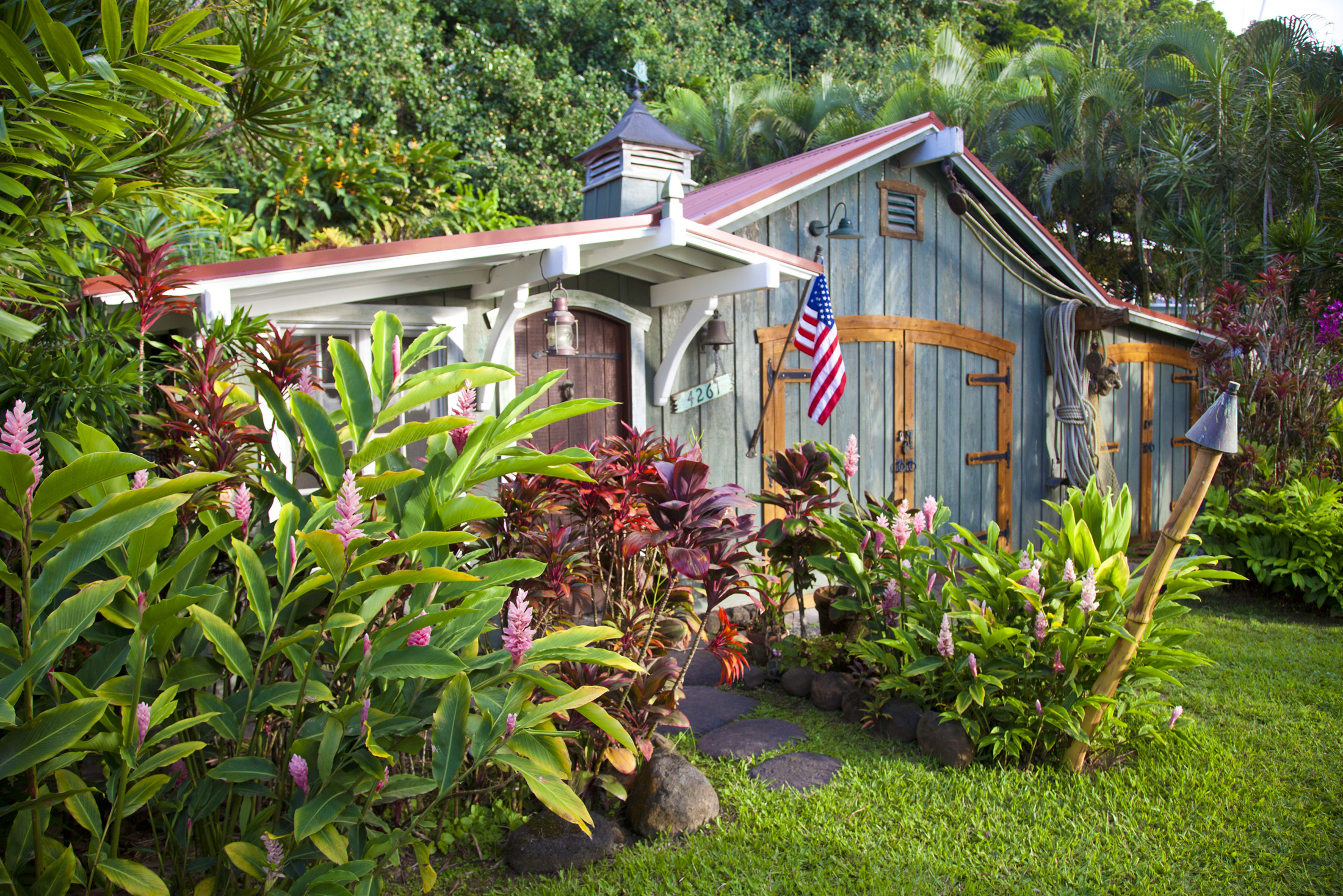4261 Anini Road, Unit 2 Princeville, HI 96722 - Photo 1 of 28 a view of a house with large windows