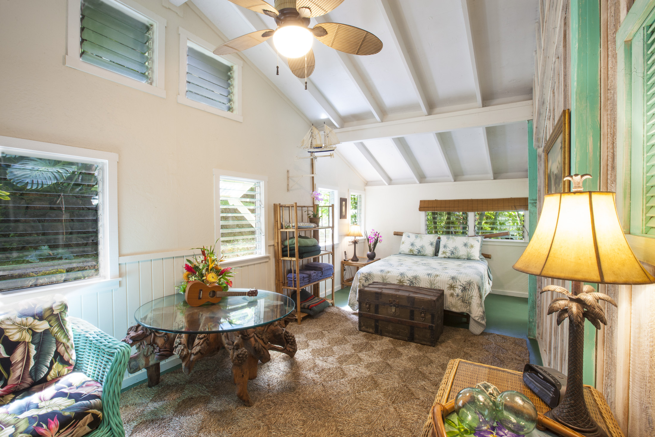 4261 Anini Road, Unit 2 Princeville, HI 96722 - Photo 12 of 28 a living room with furniture and a flat screen tv