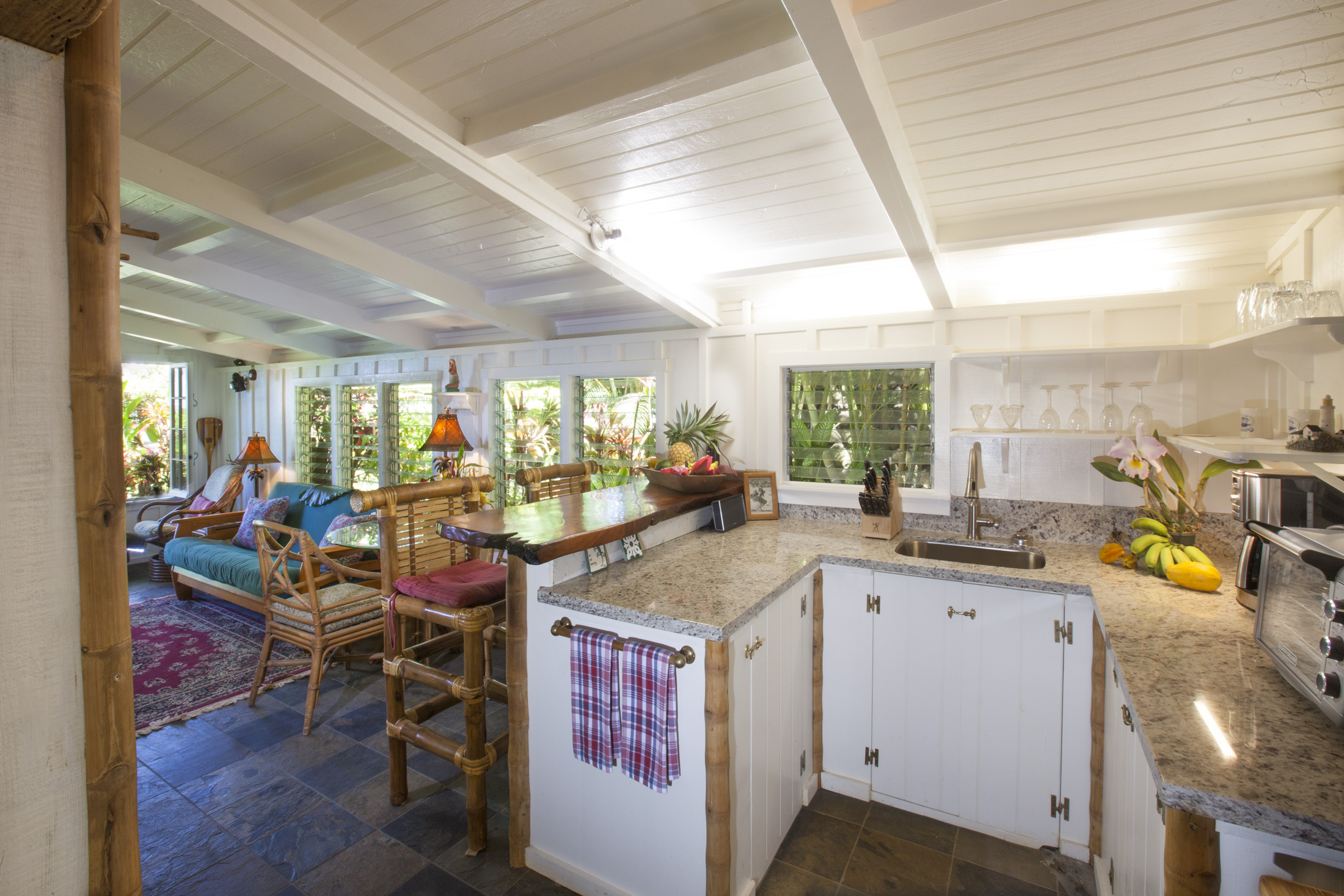 4261 Anini Road, Unit 2 Princeville, HI 96722 - Photo 13 of 28 a view of a kitchen and dining area in the room