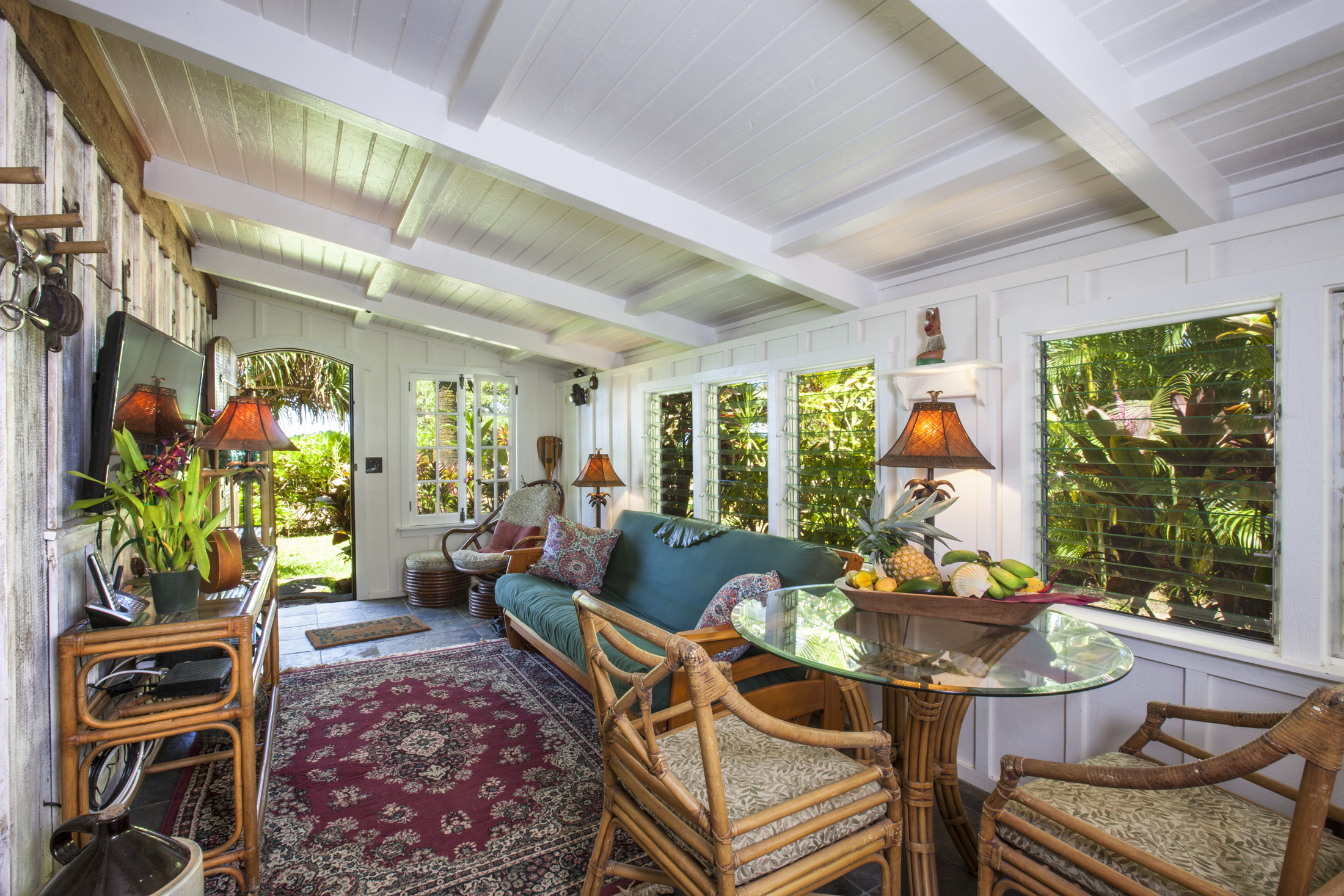 4261 Anini Road, Unit 2 Princeville, HI 96722 - Photo 16 of 28 a living room with furniture and a potted plant