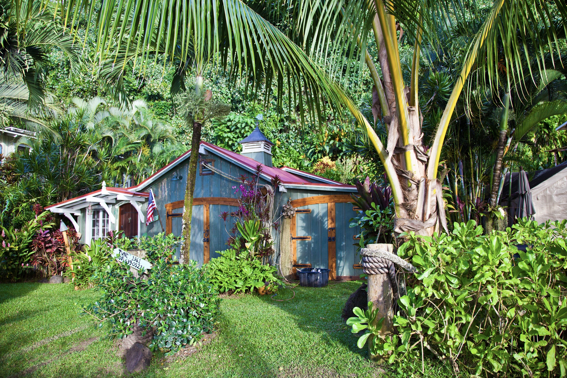 4261 Anini Road, Unit 2 Princeville, HI 96722 - Photo 21 of 28 a backyard of a house with lots of green space