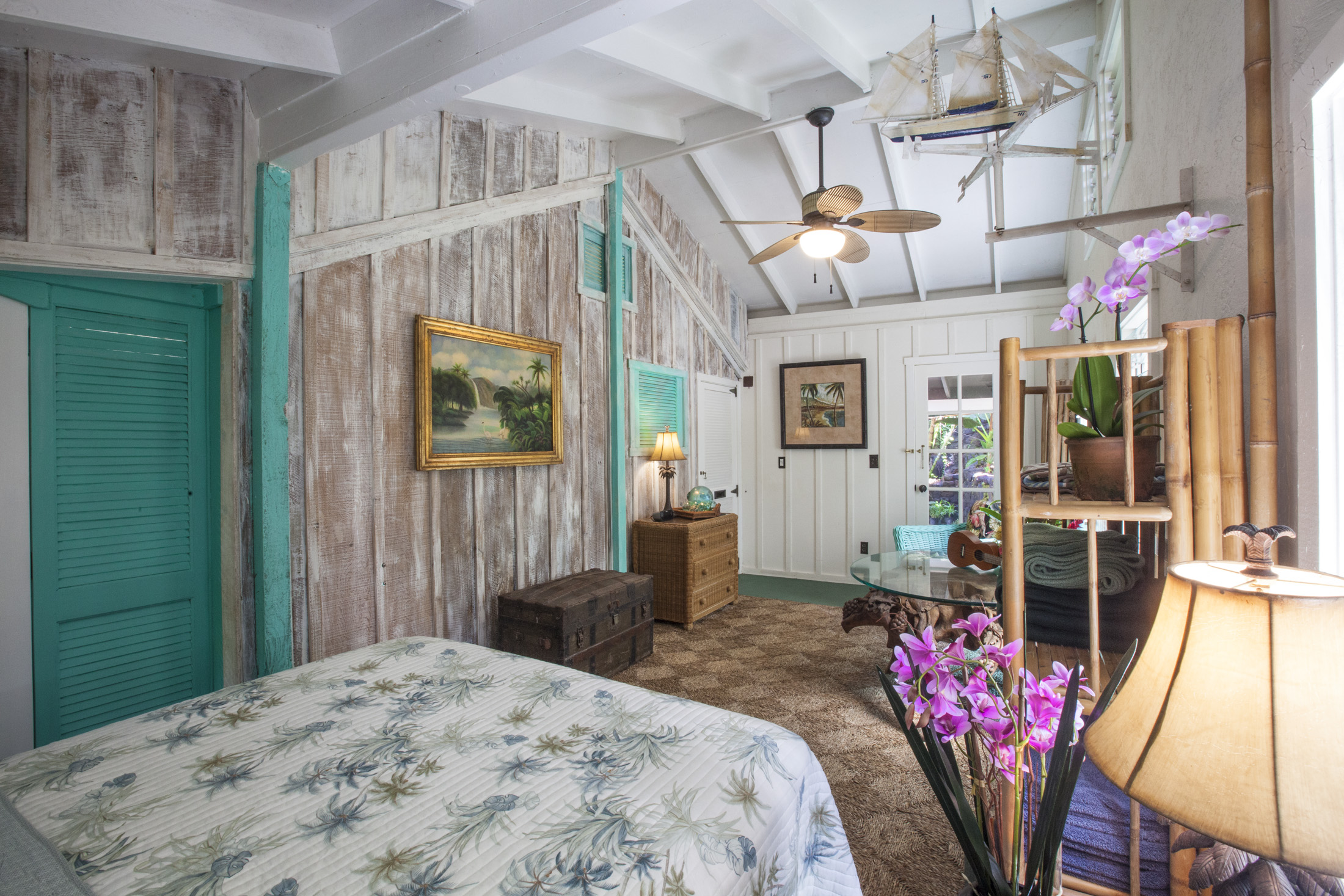 4261 Anini Road, Unit 2 Princeville, HI 96722 - Photo 3 of 28 a bedroom with a bed and a chandelier