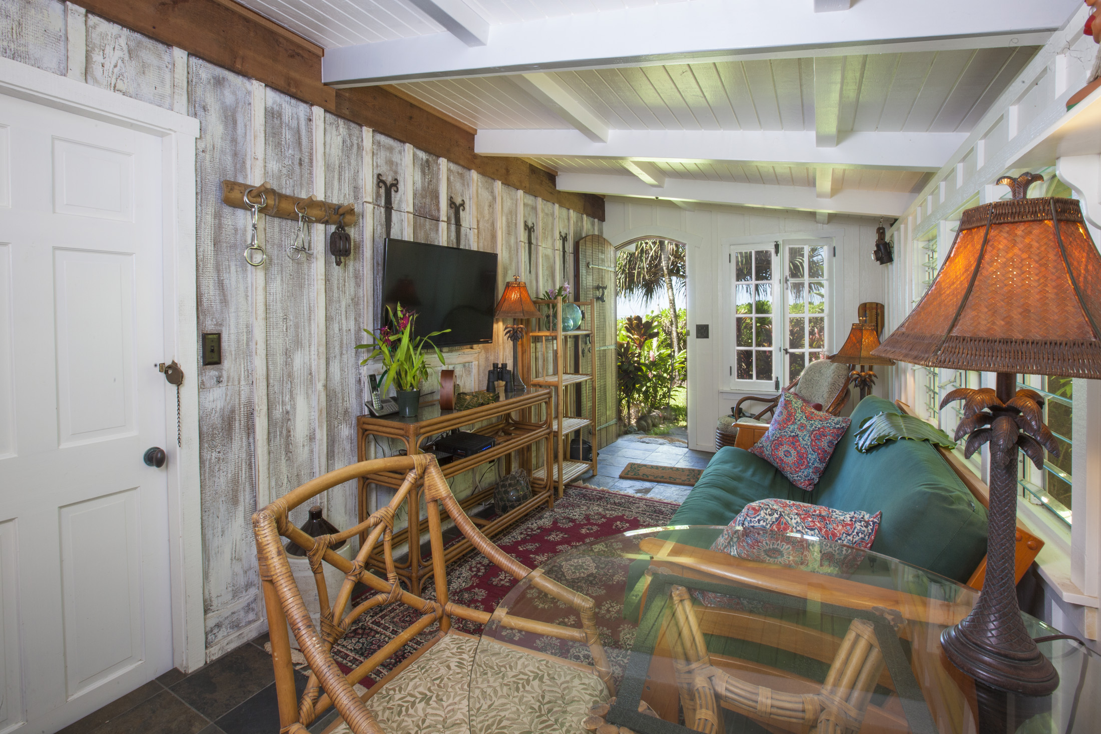 4261 Anini Road, Unit 2 Princeville, HI 96722 - Photo 4 of 28 a living room with furniture a flat screen tv and a shower