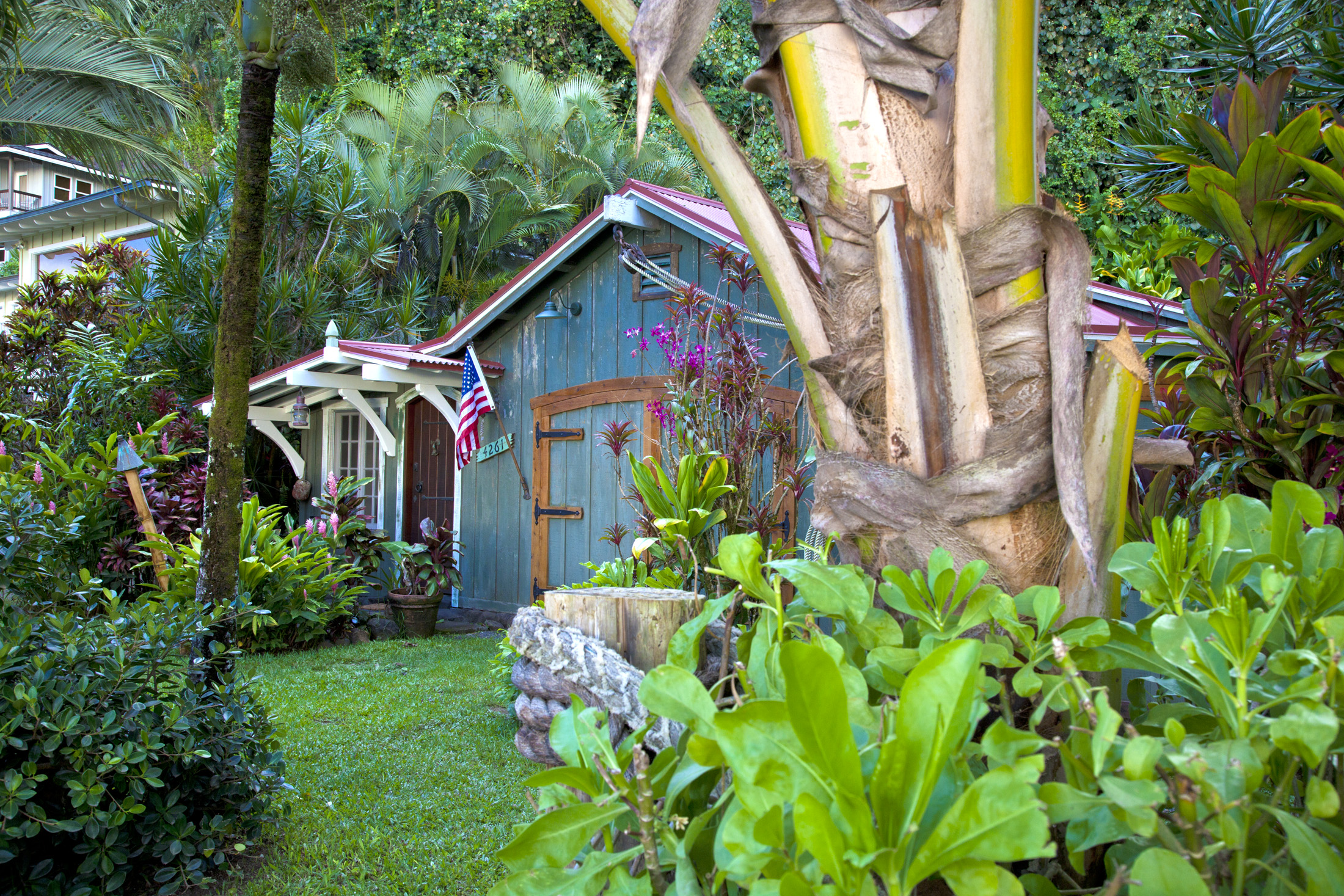 4261 Anini Road, Unit 2 Princeville, HI 96722 - Photo 10 of 28 a backyard of a house with lots of green space