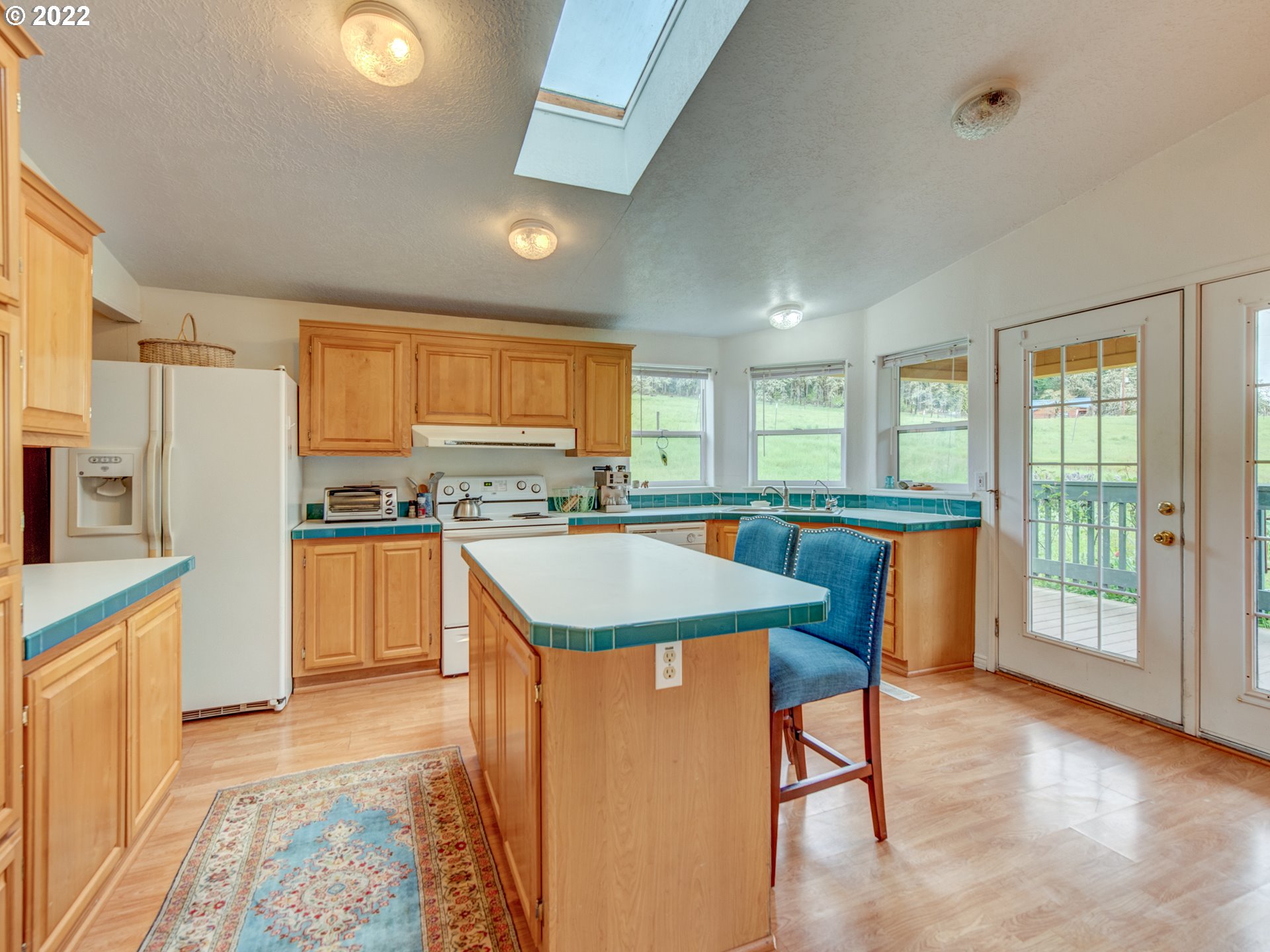 39283 Little Fall Creek Road Fall Creek, OR 97438 - Photo 8 of 28 a large kitchen with granite countertop lots of counter space and wooden floor