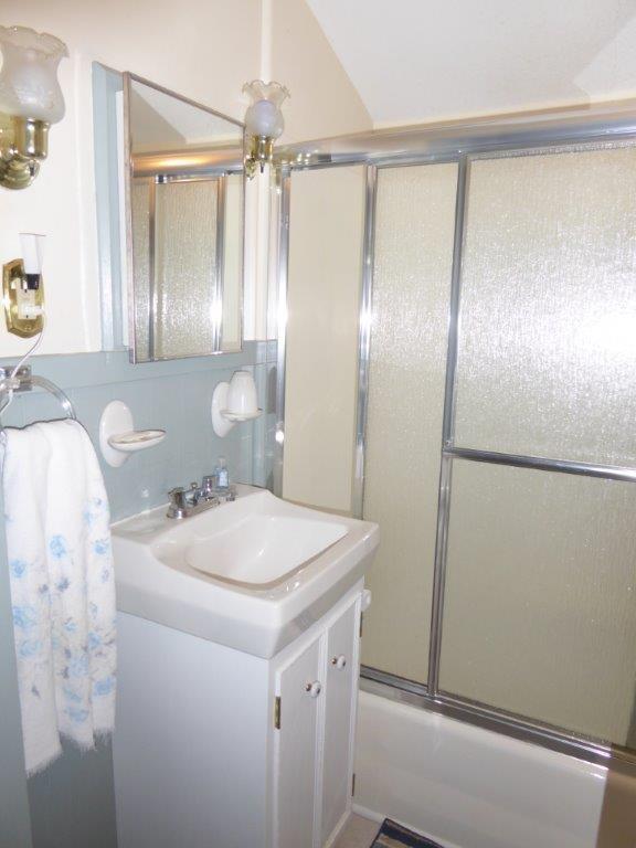 25 Shore Path Road Auburn, ME 04210 - Photo 16 of 33 Bright bathroom in the main cottage