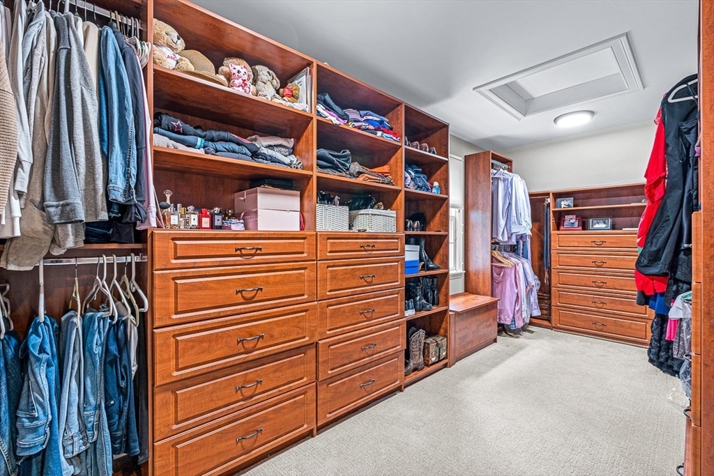 54 Homestead Park Needham, MA 02494 - Photo 15 of 26 a view of walk in closet with clothes and shoes