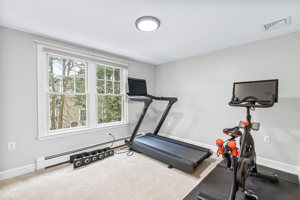 54 Homestead Park Needham, MA 02494 - Photo 19 of 26 a room with gym equipment and a window