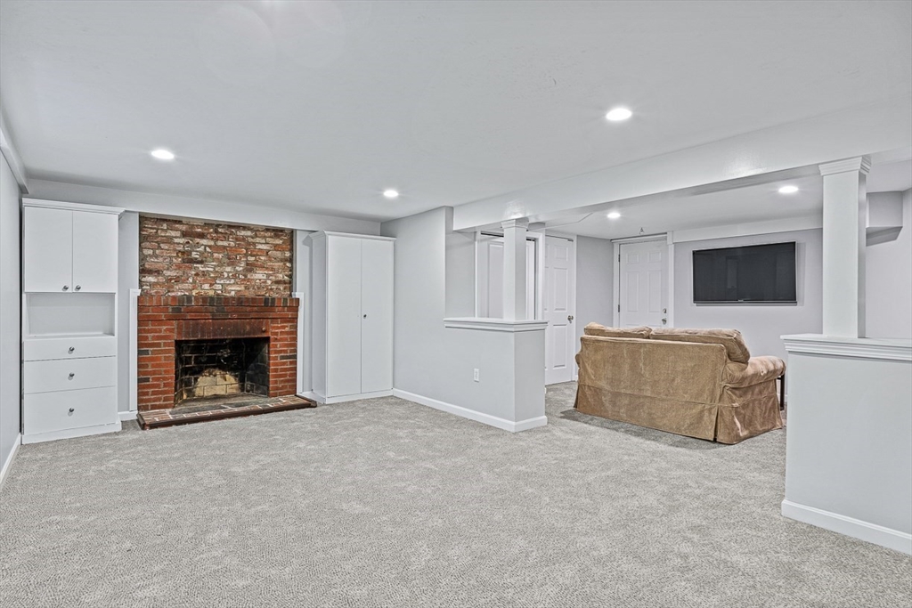 54 Homestead Park Needham, MA 02494 - Photo 21 of 26 a view of an empty room with a fireplace and a window