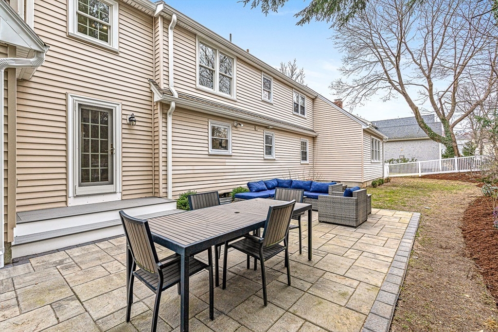54 Homestead Park Needham, MA 02494 - Photo 25 of 26 a view of a dinning table and chairs in backyard of the house