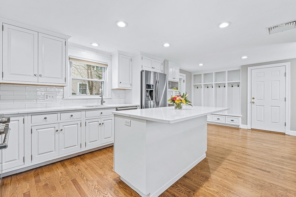 54 Homestead Park Needham, MA 02494 - Photo 3 of 26 a kitchen with white cabinets and sink