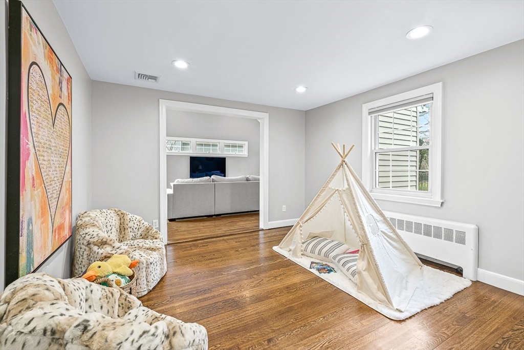 54 Homestead Park Needham, MA 02494 - Photo 9 of 26 a bed room with a bed and a television