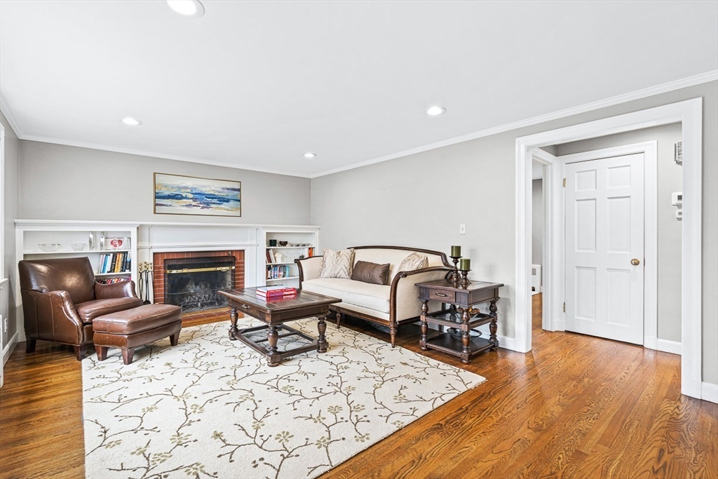 54 Homestead Park Needham, MA 02494 - Photo 10 of 26 a living room with furniture a fireplace and wooden floor