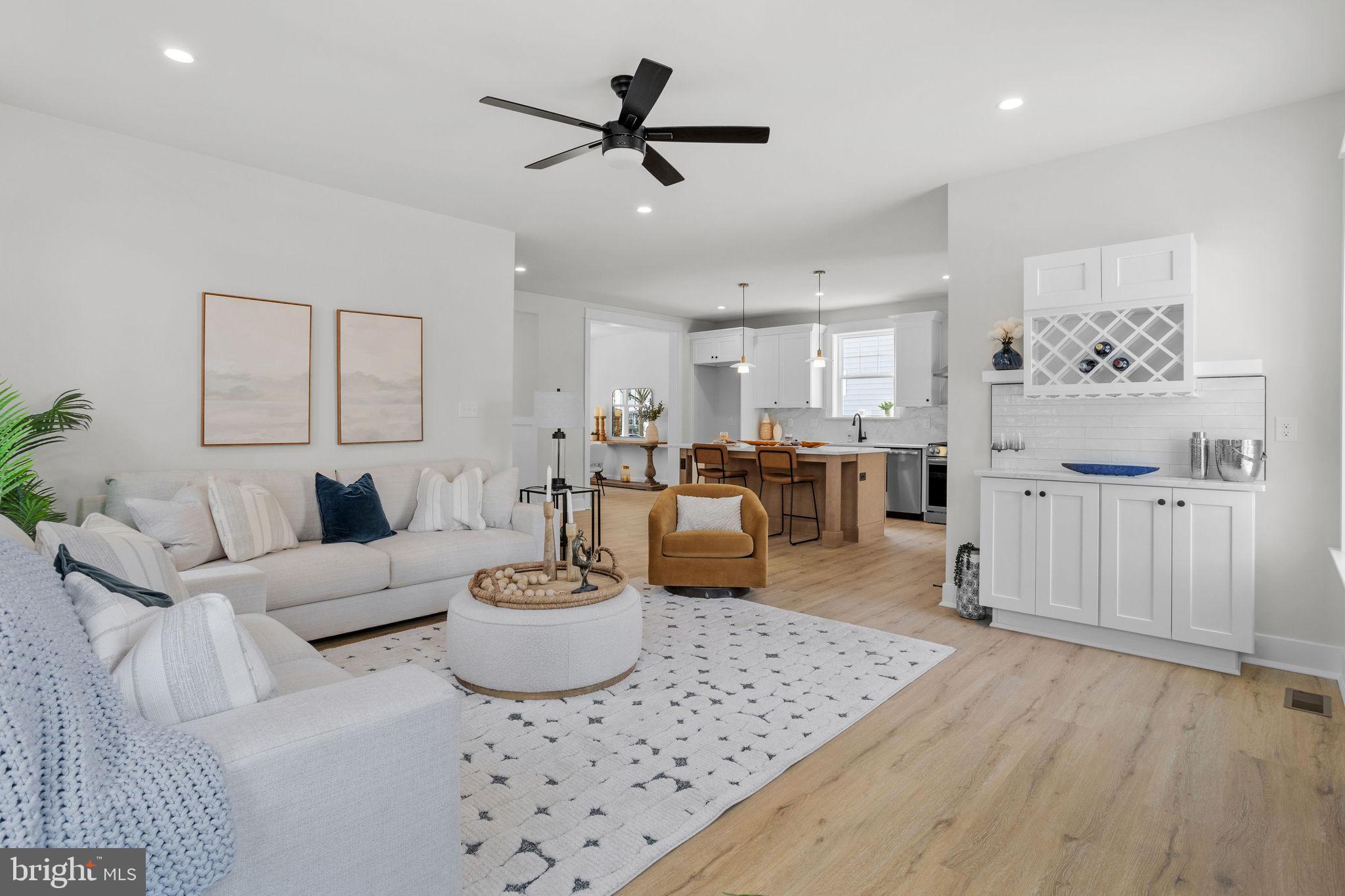 404 Midway Riverton, NJ 08077 - Photo 2 of 20 a living room with furniture a rug and kitchen view