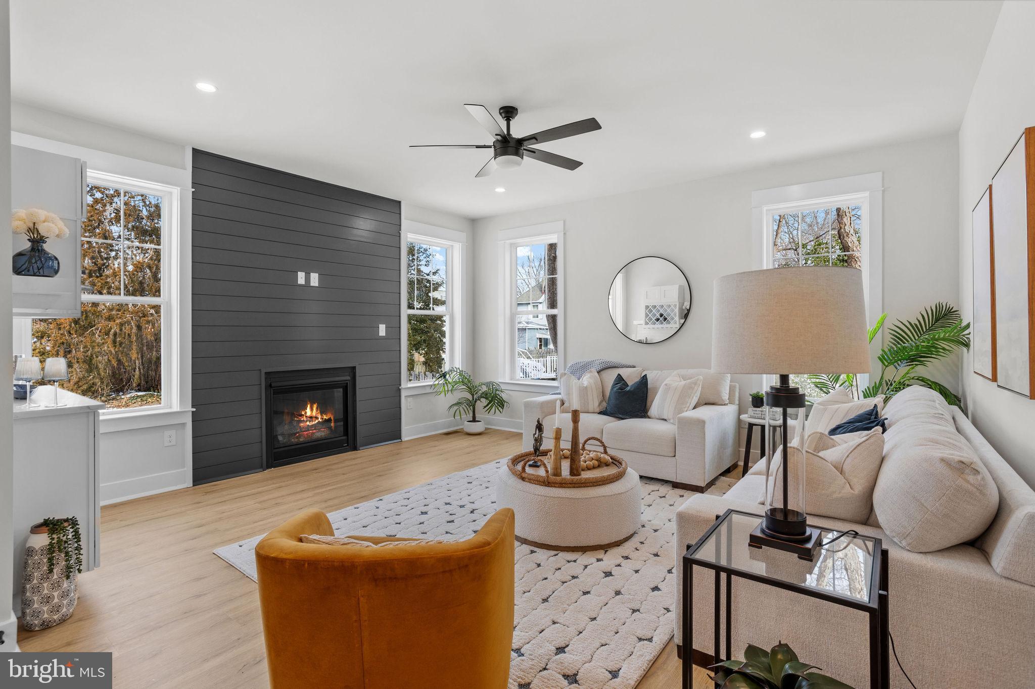 404 Midway Riverton, NJ 08077 - Photo 3 of 20 a living room with furniture a fireplace and window