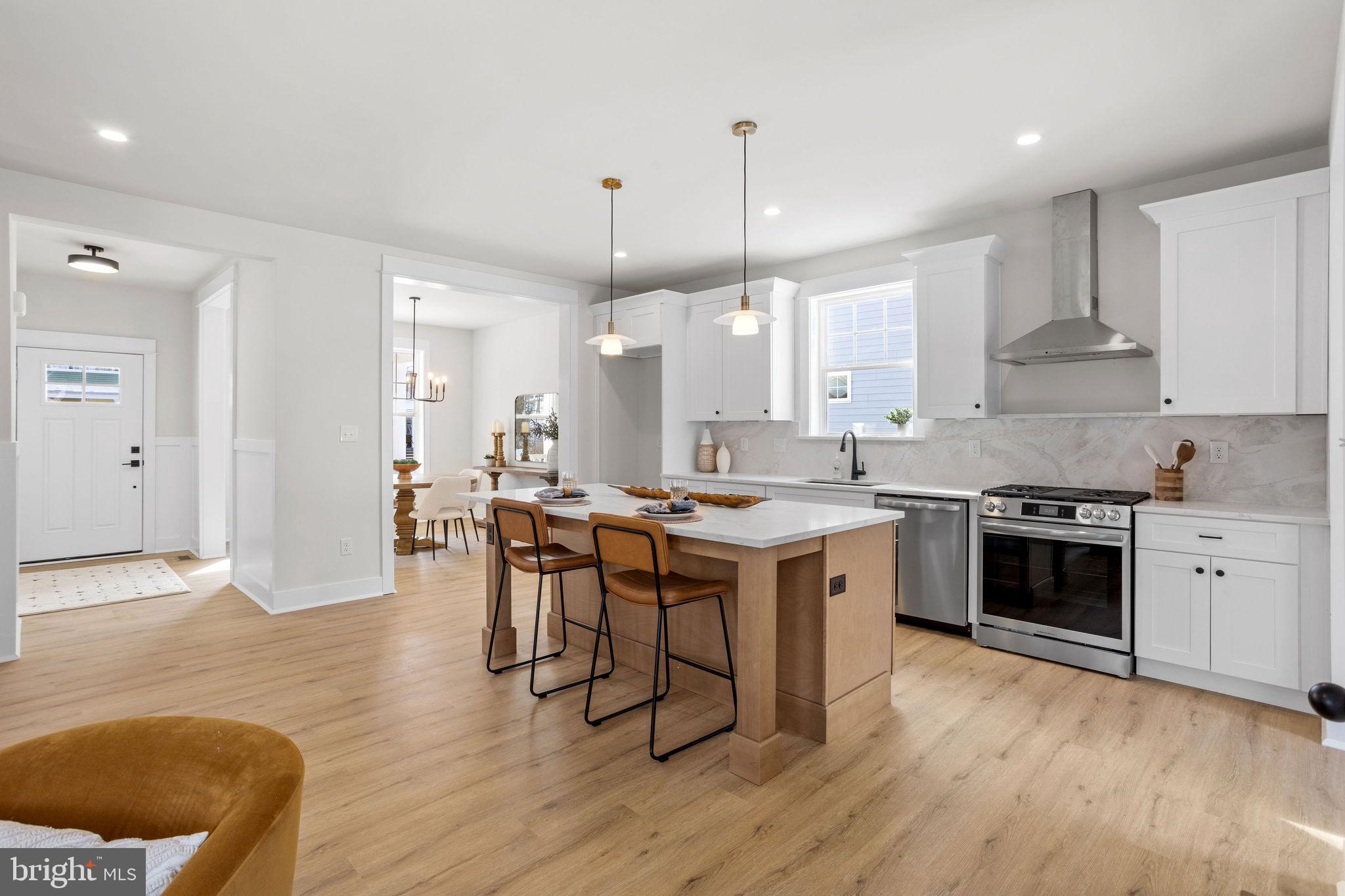 404 Midway Riverton, NJ 08077 - Photo 5 of 20 a large kitchen with cabinets wooden floor and stainless steel appliances