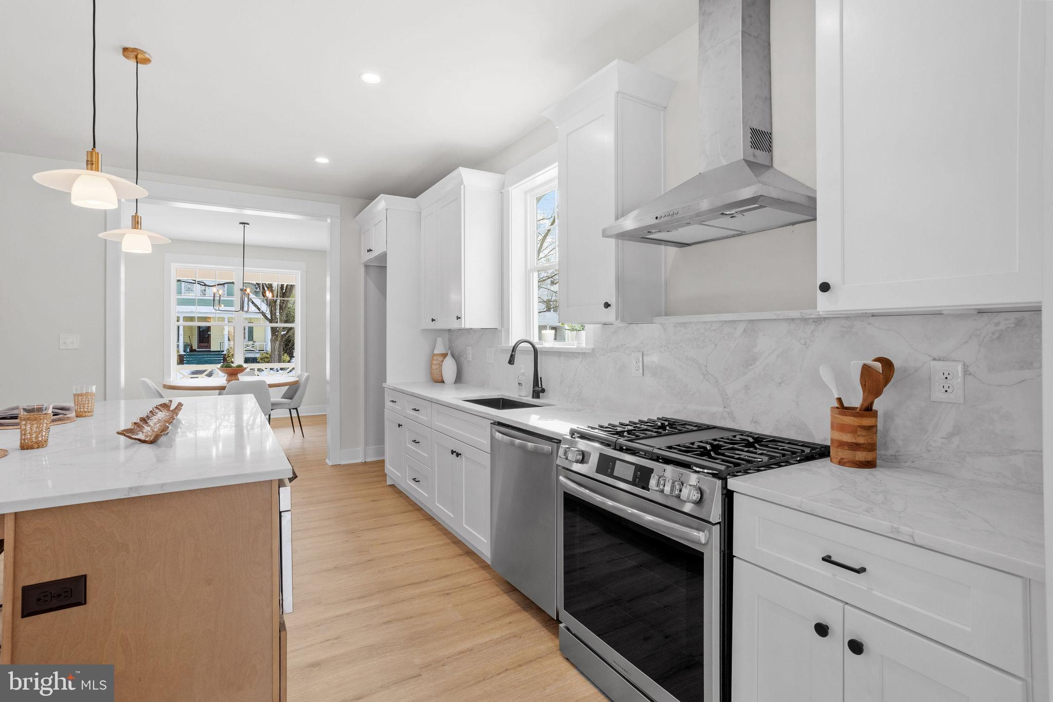 404 Midway Riverton, NJ 08077 - Photo 6 of 20 a kitchen with stainless steel appliances granite countertop a stove and a sink