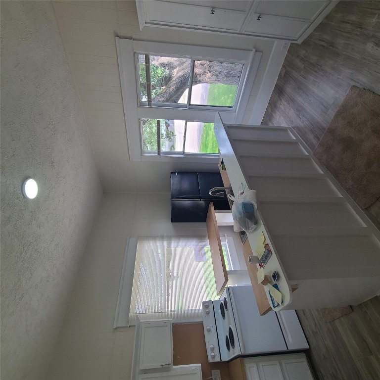 615 East Washington Street Giddings, TX 78942 - Photo 14 of 17 a kitchen with stainless steel appliances a stove a sink and a refrigerator