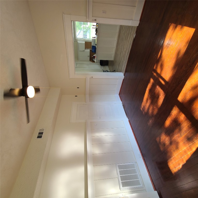 615 East Washington Street Giddings, TX 78942 - Photo 15 of 17 a view of kitchen and hall with wooden floor