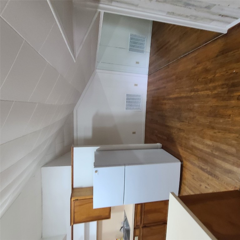 615 East Washington Street Giddings, TX 78942 - Photo 9 of 17 a view of a kitchen with wooden floor