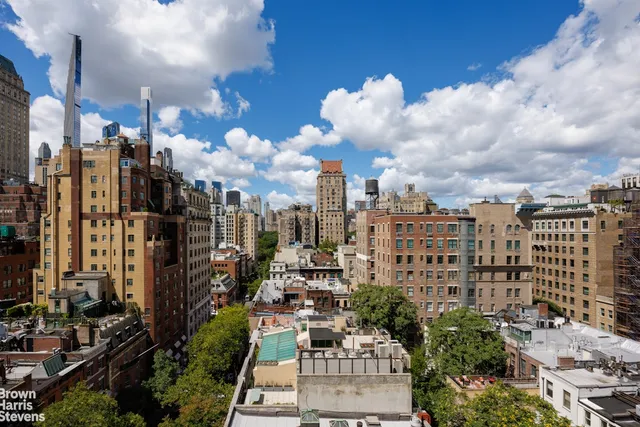 a room with furniture a flat screen tv and a window