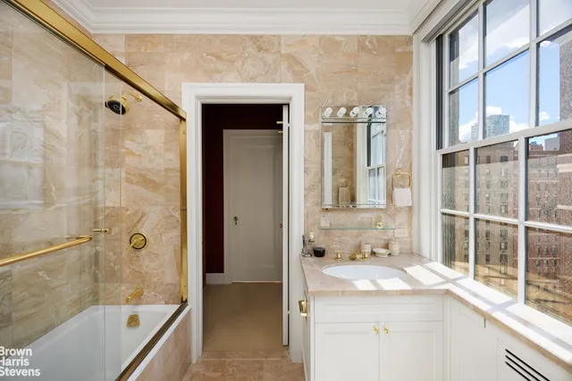 a bedroom with a bed couch and window