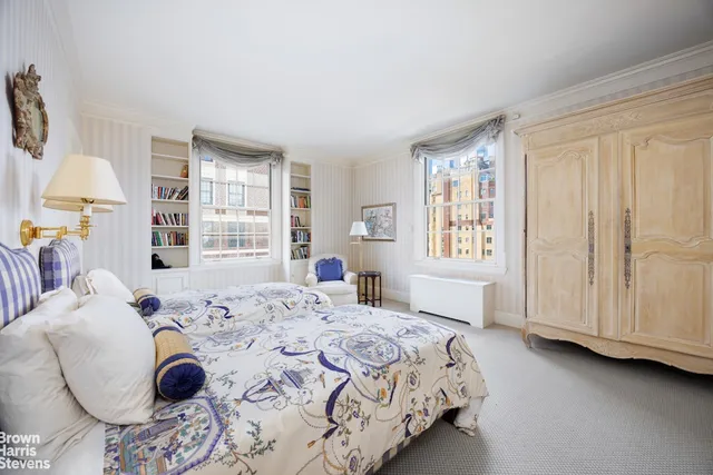 a bathroom with a granite countertop sink a mirror and a bathtub