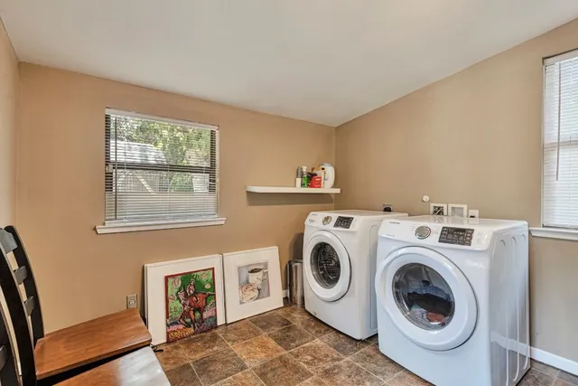 a utility room with dryer and washer
