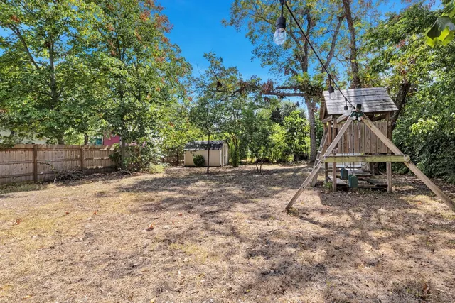a view of backyard with a table and chair